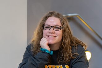 Autumn smiles in the lobby of Savitz Hall.