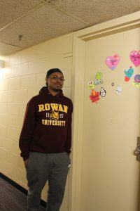 jalen in front of his dorm room