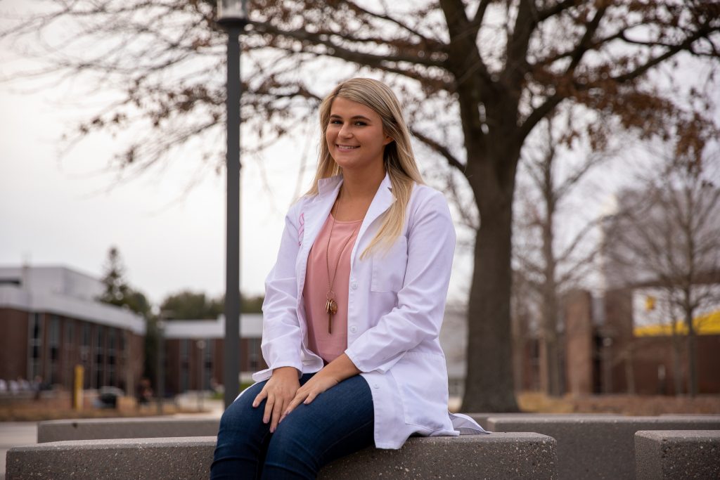 Holli-Joi Sullivan outside close to Robinson Hall.