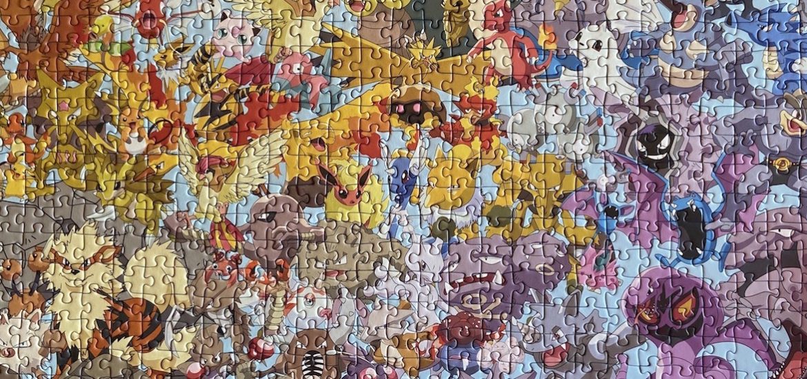 Close up of a completed multi-colored Pokemon puzzle.