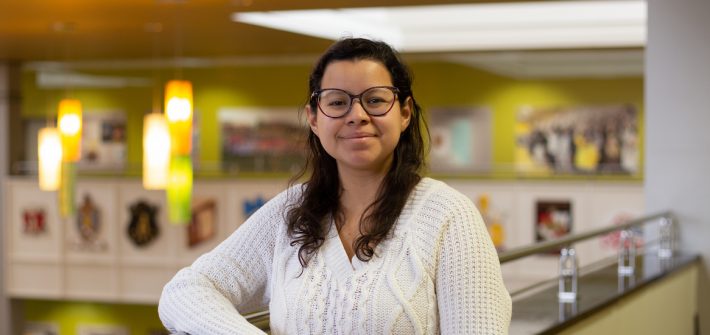 Mariana Cardenas poses inside the Chamberlain Student Center.