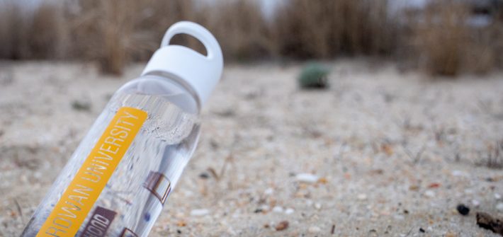 rowan university water bottle on the beach