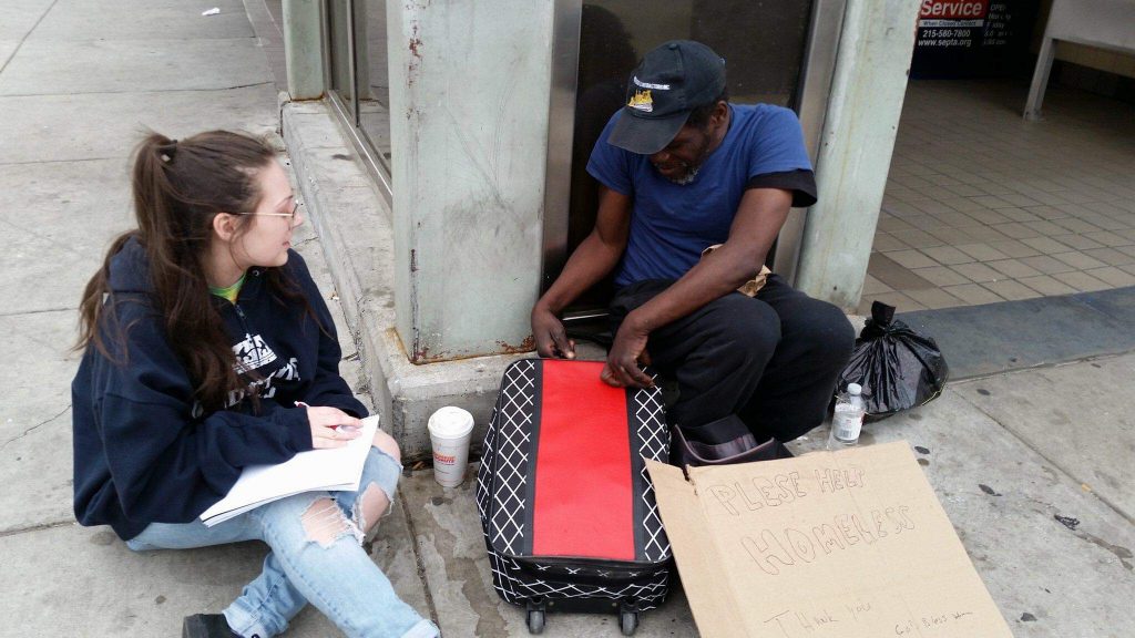 Rowan student Lauren Purnell interviews a subject for her blog on the homeless