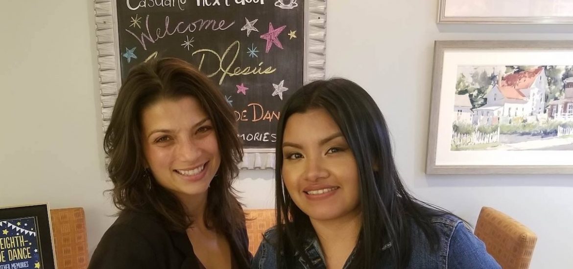 Rosalba standing with her cooperating teacher.