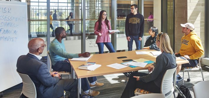Rowan students discuss a business plan in the Rohrer College of Business.