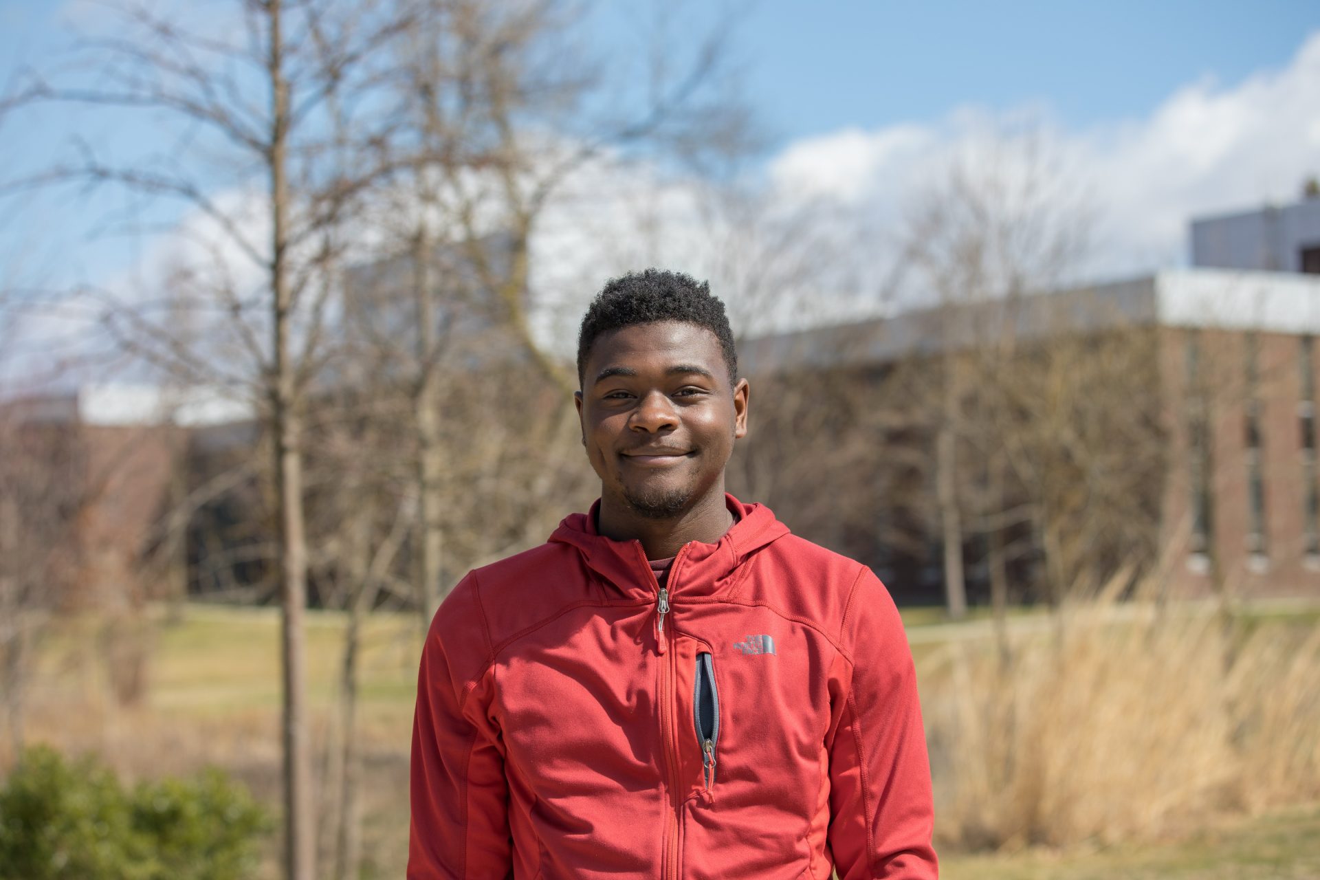 Robert Brown smiles for a portrait on campus.