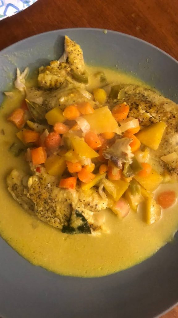 Curry fish with mangoes and carrots