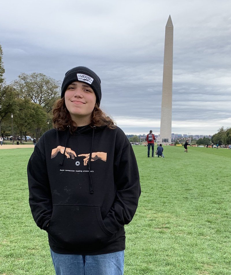 Ambbar stands in front of the Washington monument.  