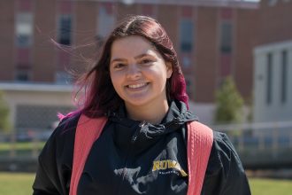 Brianna poses for a photo outside Business Hall.