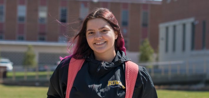 Brianna poses for a photo outside Business Hall.