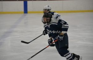 Matt playing ice hockey.