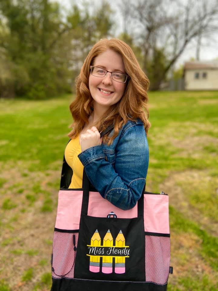 Jessica Heady holding a bag that says Miss Heady on it