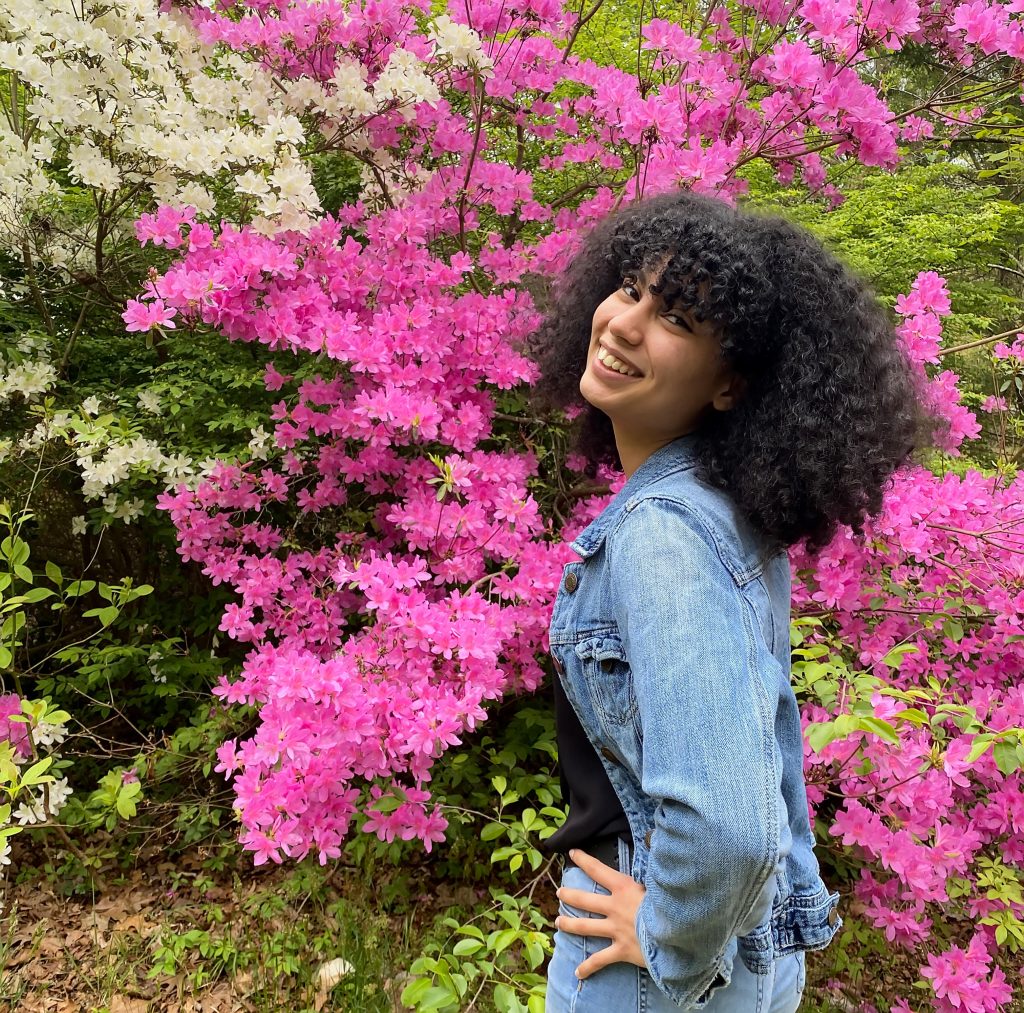 Selfie of AnnMarie in front of pink and white azaleas