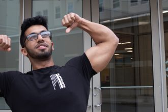 Krishna flexing his muscles outside 232 Victoria St.