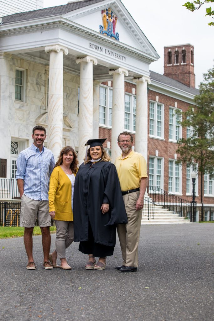 Megan Pfizenmayer stands outside of Bunce Hall with her family