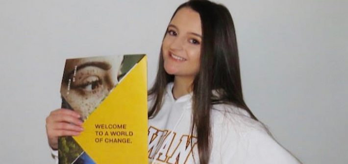 Photo of Brianna holding her admissions packet