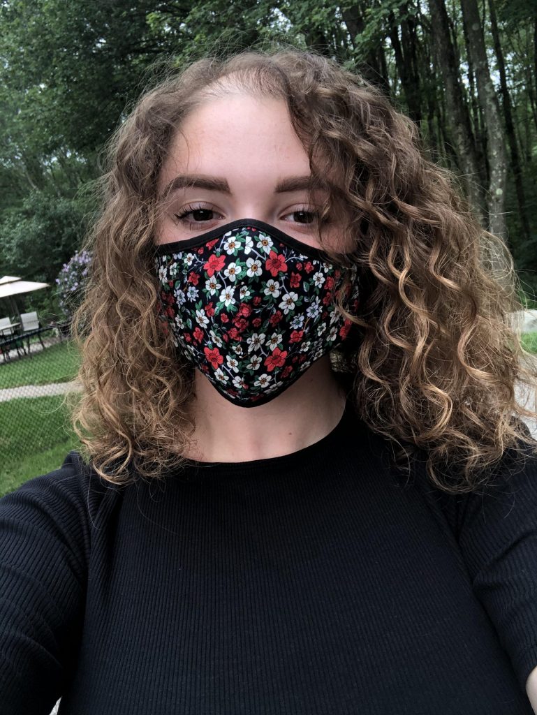 Music industry major Bianca Torres wears a floral mask