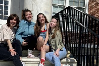 Erica sitting with friends on the Bunce Steps
