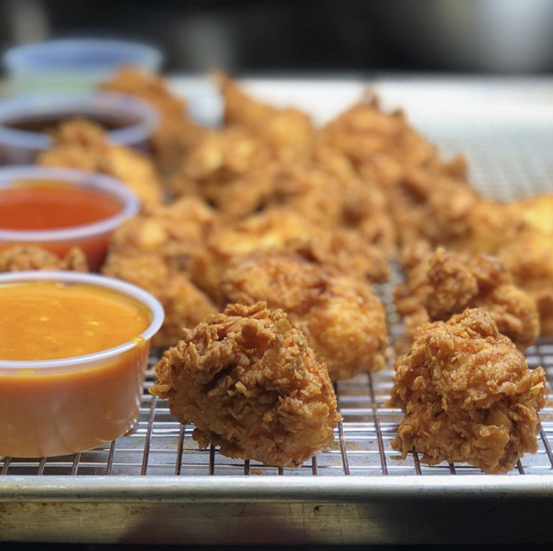 Wings and a sampling of sauces at The Wing Kitchen