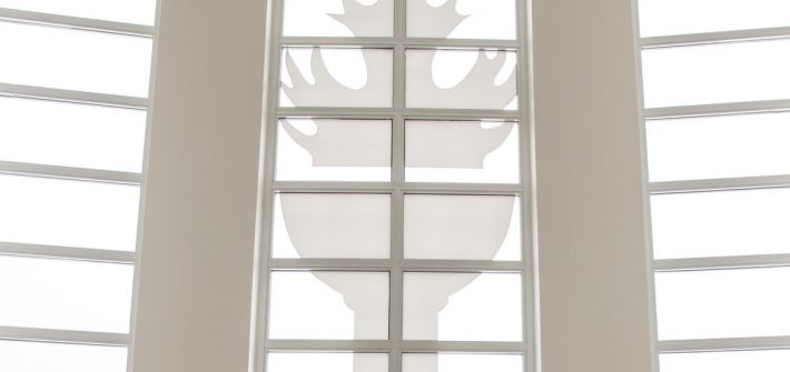 Torch image in the lobby of Campbell Library.