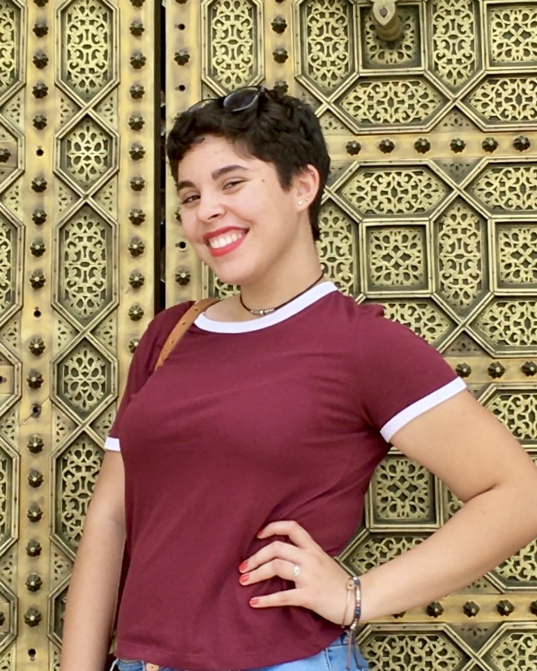 Nadine posing and smiling for a picture.