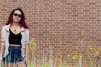 Stephanie at Wilson Hall with greenery and flowers