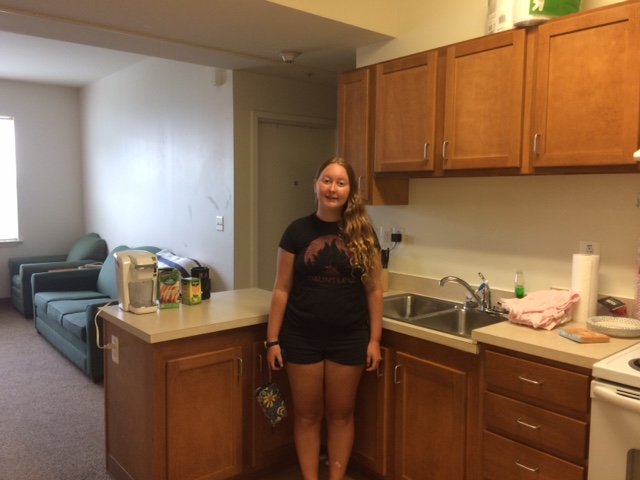 Rachel in her kitchen in her apartment.