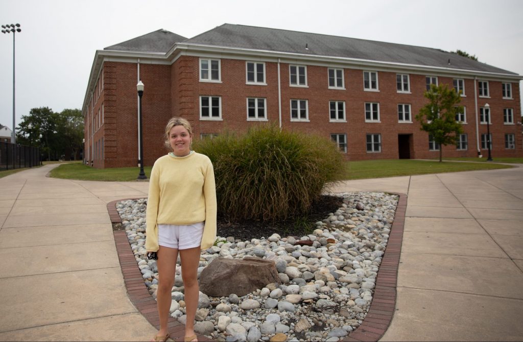 Rachel poses in front of Willow Hall.