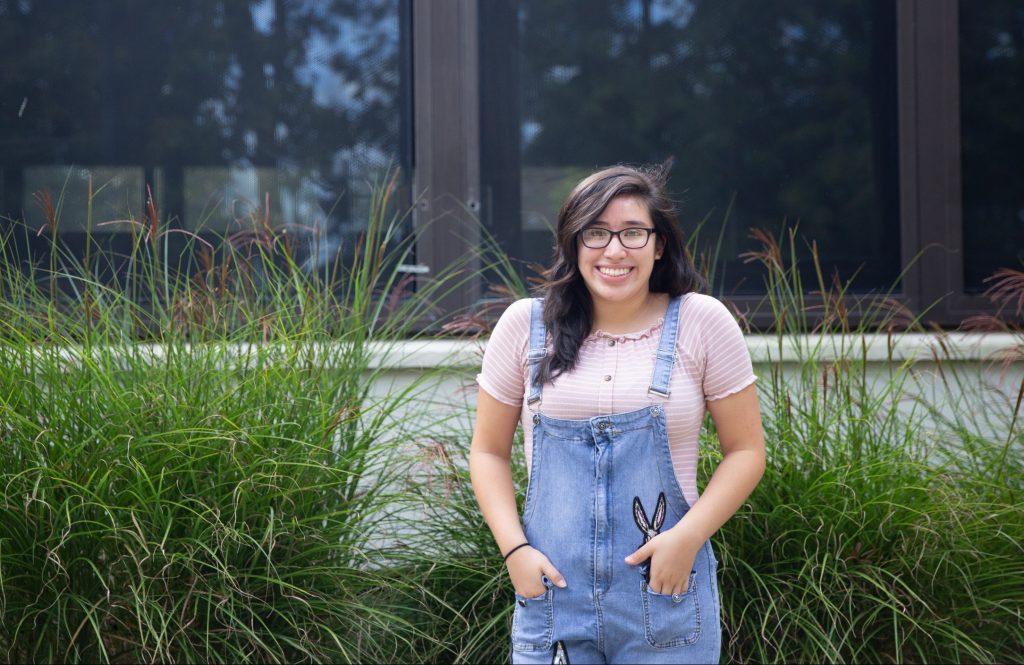 Illiana poses in front of Evergreen. 