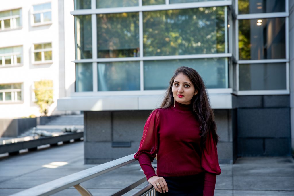 Niyati standing outside of the Engineering Building.