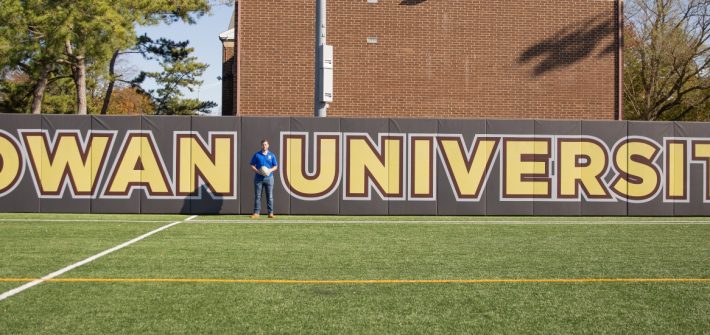 Chase poses on the intramural field at Rowan.