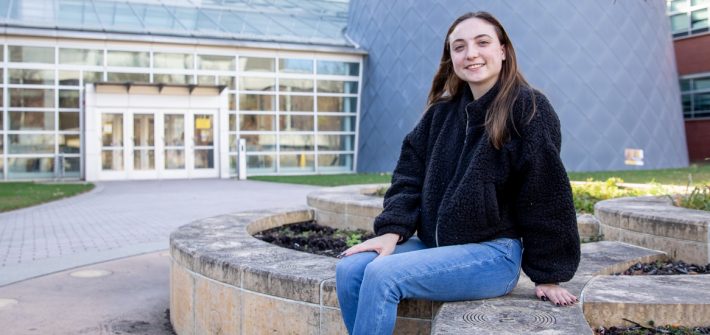 Erin sitting outside of the Science Hall.