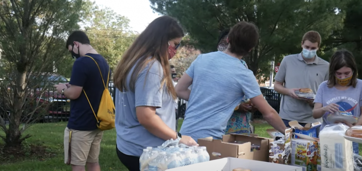 Hillel Club members in line to get jewish treats.