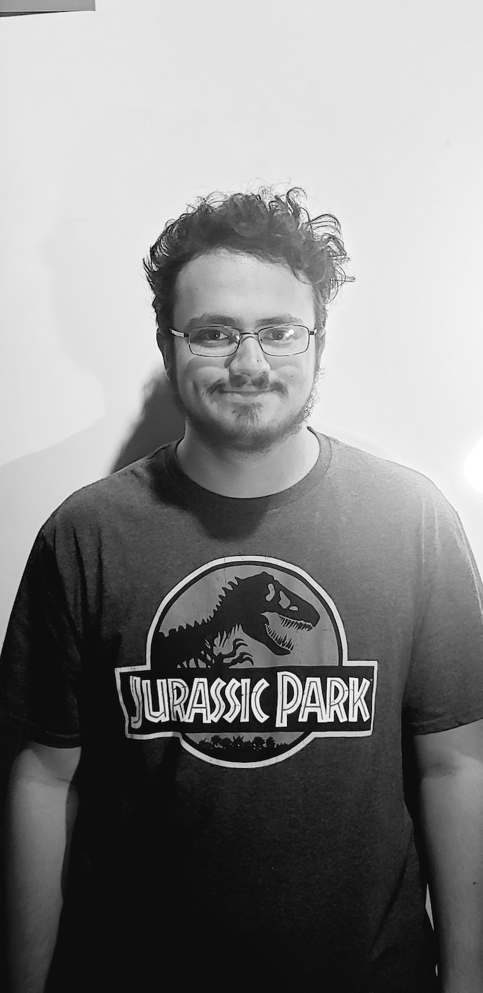 Justin wearing a Jurassic Park t-shirt.