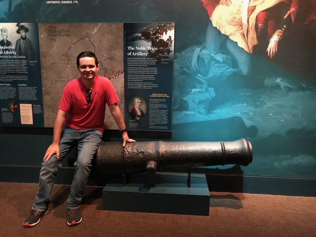 Bobby poses next to a cannon at the Museum of the American Revolution.
