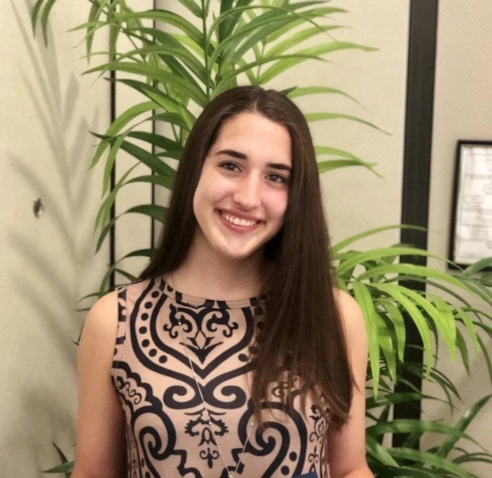 Rachel smiling for a photo.