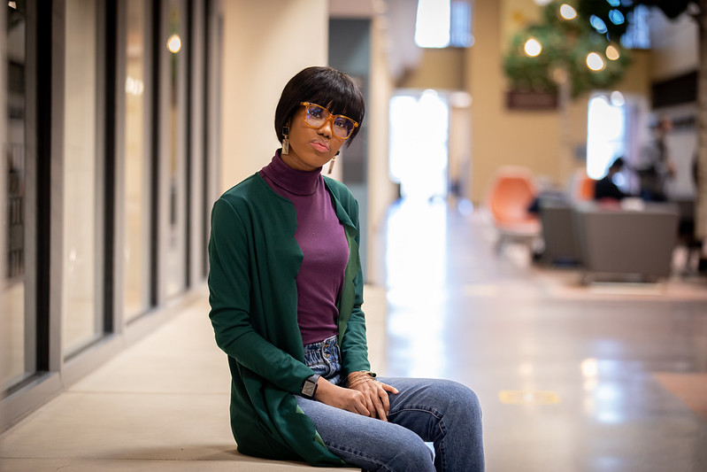 Diamonnique sits on a ledge in James Hall.