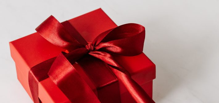 Red gift box with bow.