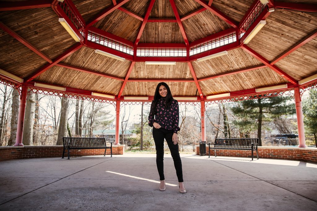 Brittany stands inside a gazebo on campus.
