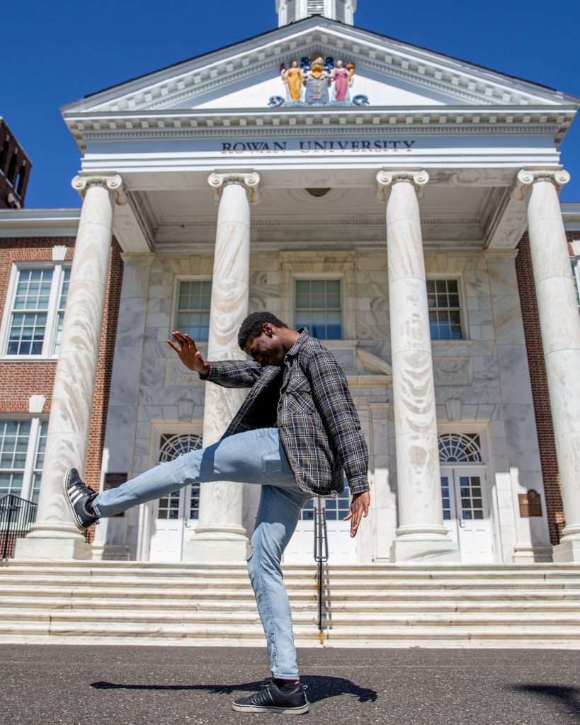 Oluwafemi posing in front of Bunce Hall