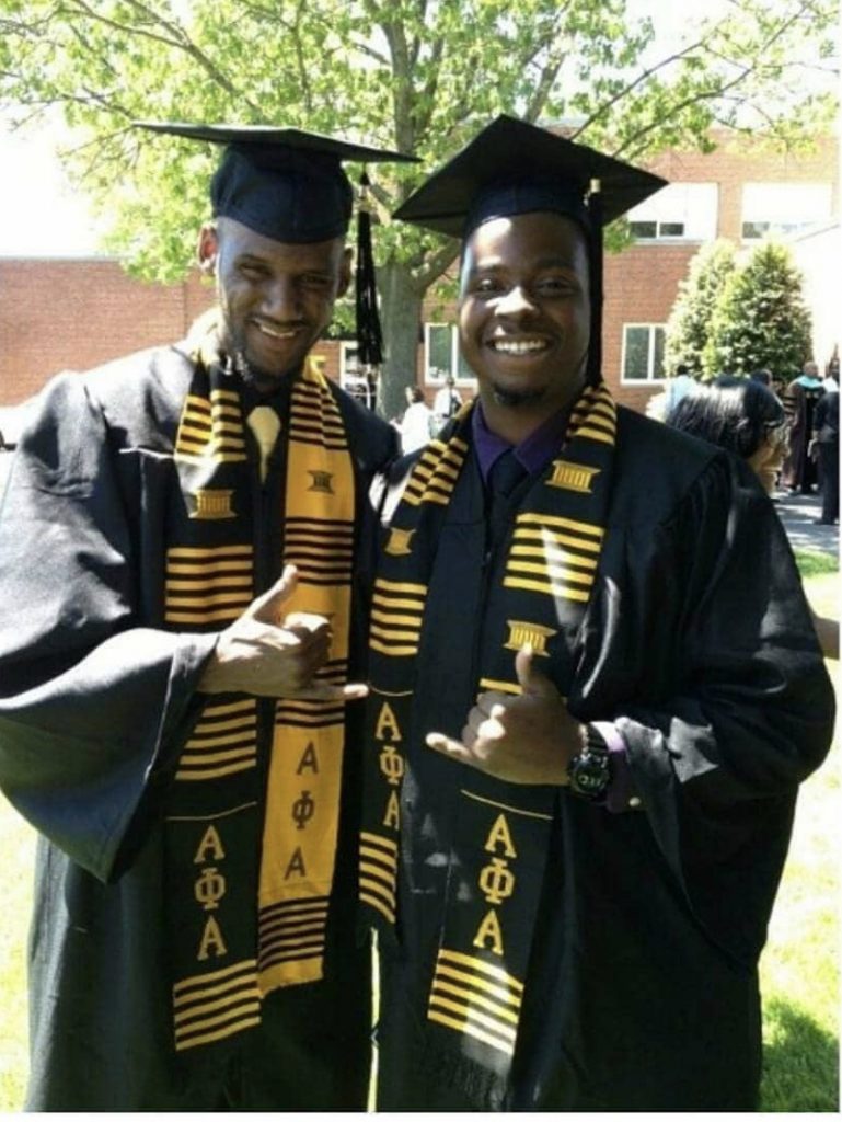 Michael (left) graduating with fellow Alpha Phi Alpha fraternity Incorporated member.