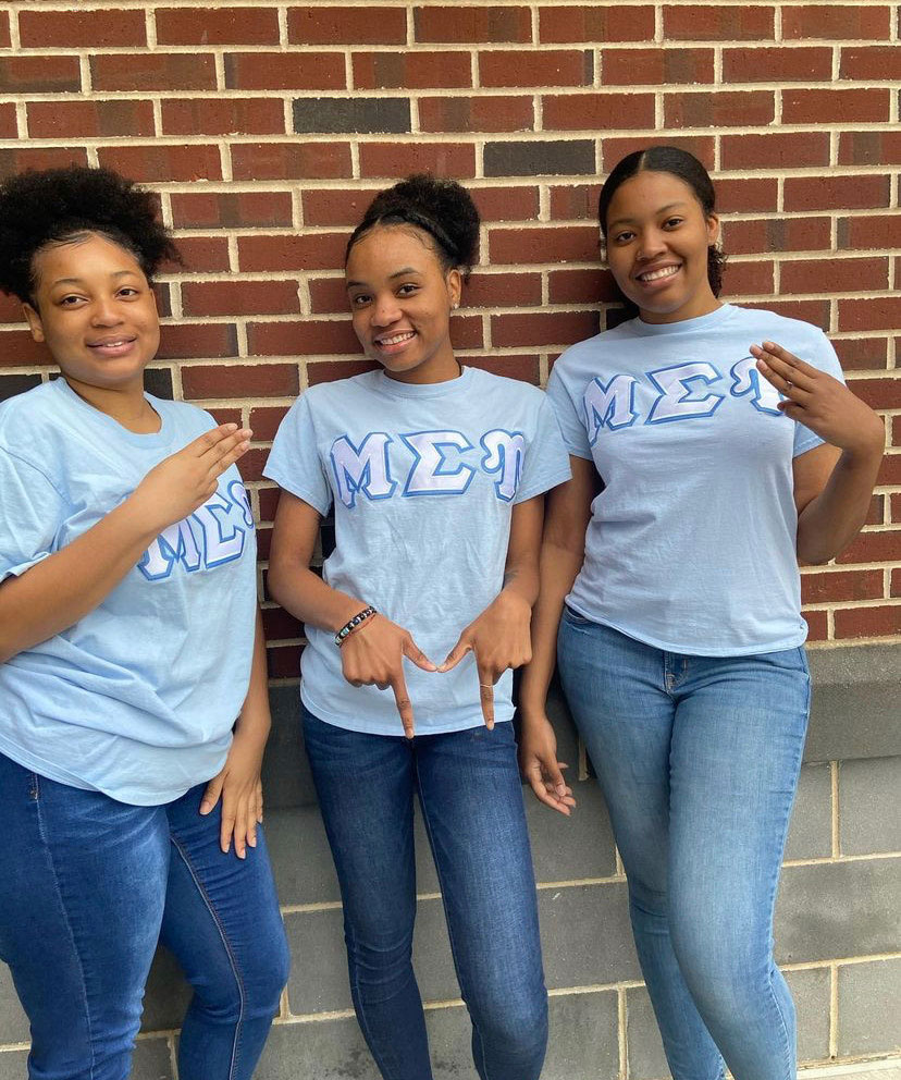 Shanell Mighty poses with two of her sisters.