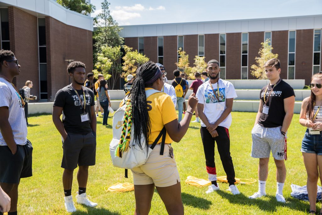 A PROS member leads her orientation group. 