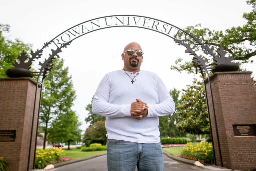 Brandon standing at the Rowan arch.