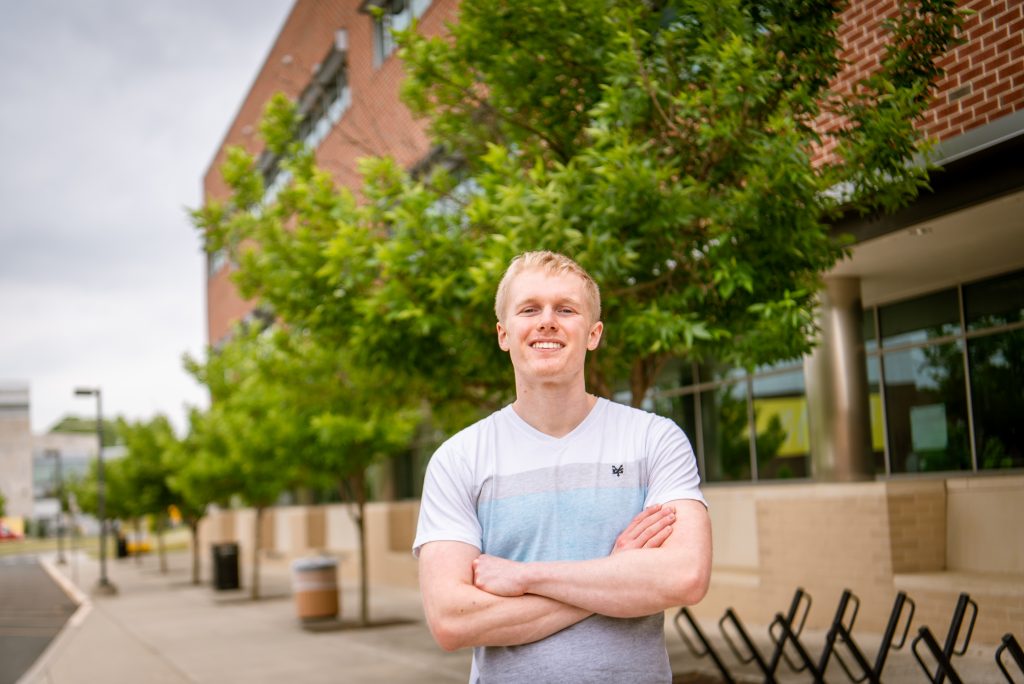 RJ Wentzell smiling outside of James Hall