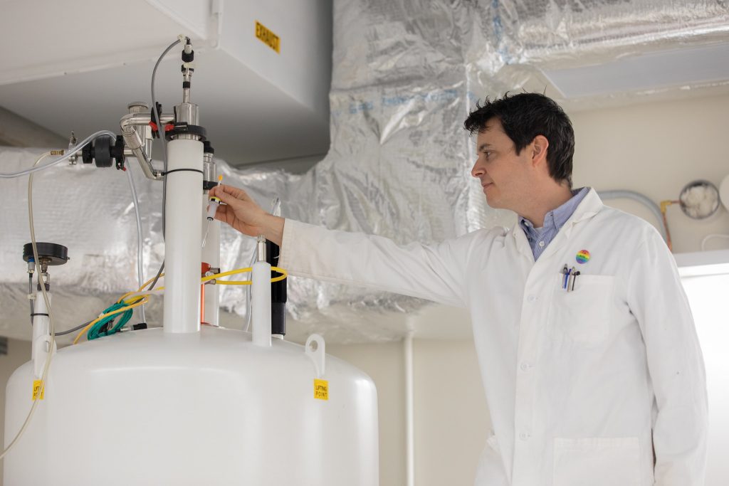 Dr. Nucci examines equipment in his lab.