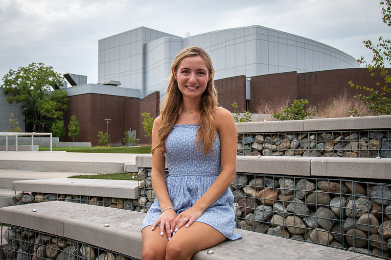 Rachel sits near Wilson Hall.