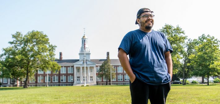 Alex stands on Bunce Green overlooking Bunce Hall.