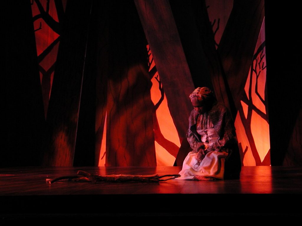 Felicia on stage alone during a production of The Crucible. 