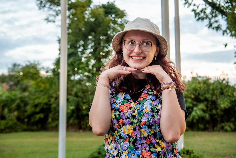 Liz poses outside near Holly Pointe.